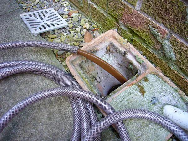 Black water from a power flush draining away