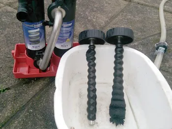Magnets cleaned after capturing sludge