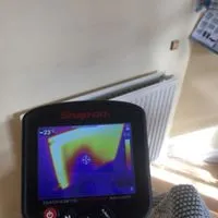 Thermal image of a radiator before power flushing showing cold areas
