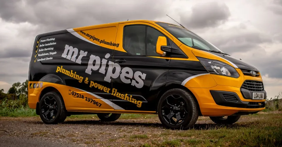 Mr Pipes plumbing and power flushing van in black and yellow livery
